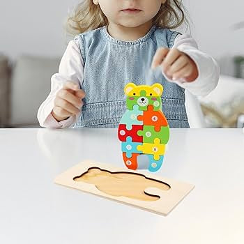 Wooden jigsaw puzzle, specifically a 3D animal-shaped puzzle (bear).