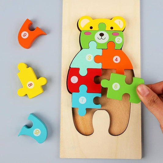 Wooden jigsaw puzzle, specifically a 3D animal-shaped puzzle (bear).